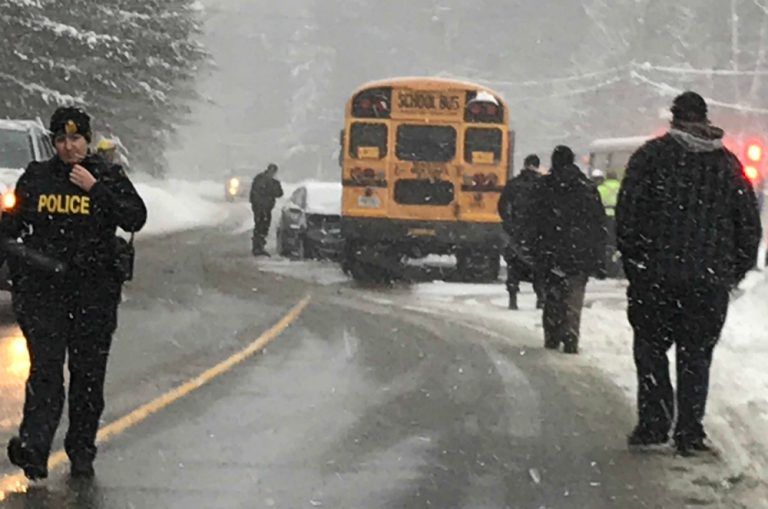 School bus and car collide on Manitoba Street at Douglas Drive